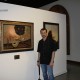 Victor in front of "Leaving Eden" and "Temptation of Christ"